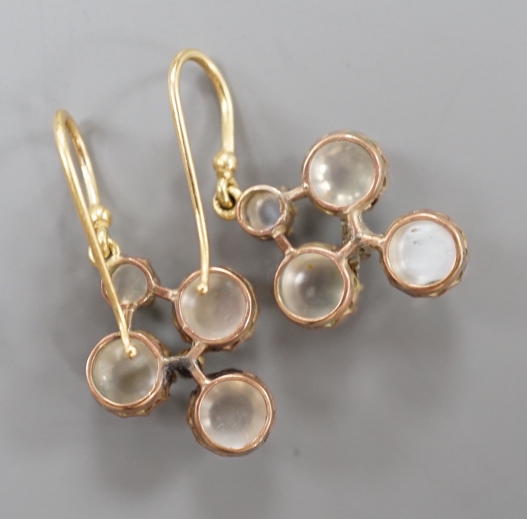 A pair of yellow metal, moonstone and diamond cluster set drop earrings, 3cm, gross weight 4.2 grams.